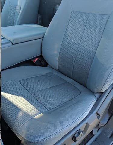 Repaired automotive seat upholstery